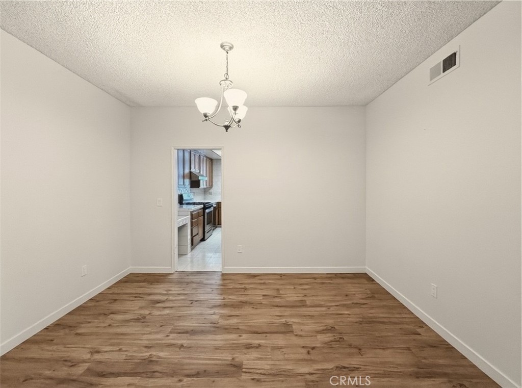 415 West Duarte Road, Unit 2 Arcadia, CA 91007 - Photo 7 of 30 a view of empty room with wooden floor