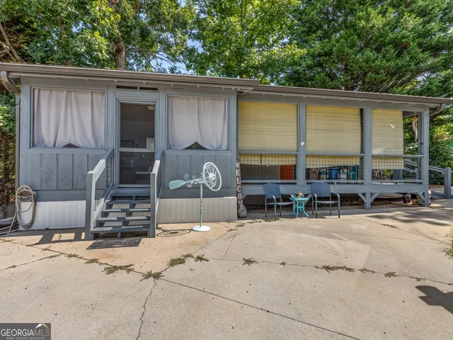 a house with trees in the background