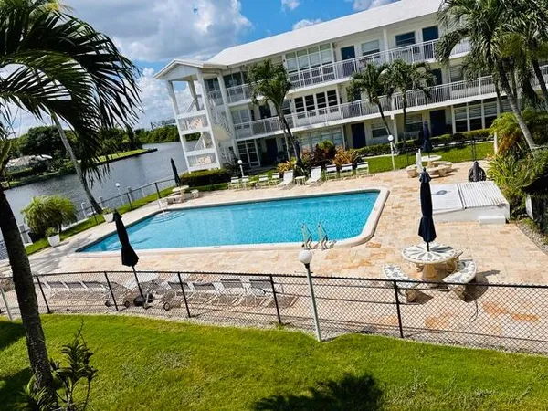 a view of a swimming pool with a lounge chairs