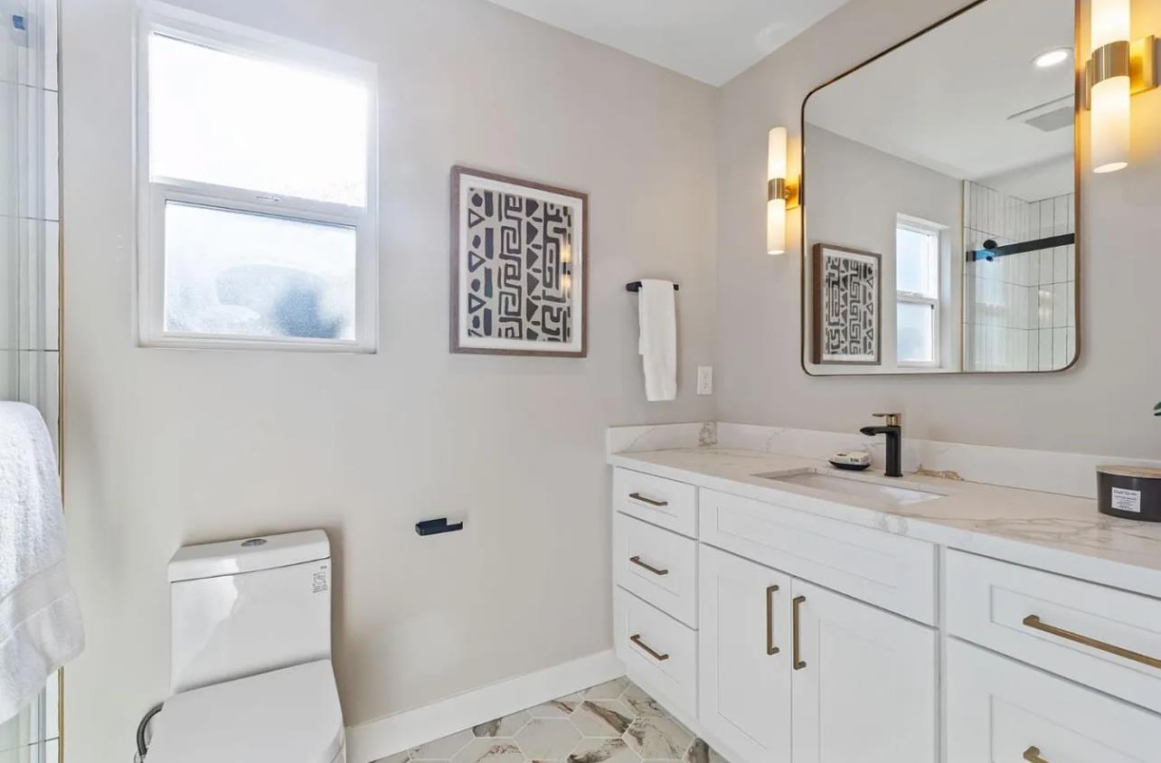 1439 Bittern Drive Sunnyvale, CA 94087 - Photo 13 of 28 a bathroom with a toilet sink and mirror