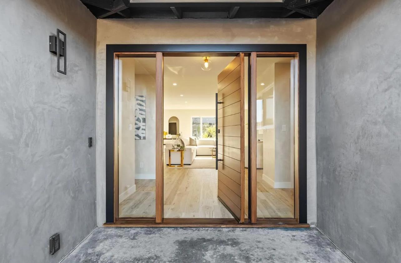 1439 Bittern Drive Sunnyvale, CA 94087 - Photo 25 of 28 a view of a hallway with wooden floor and a living room