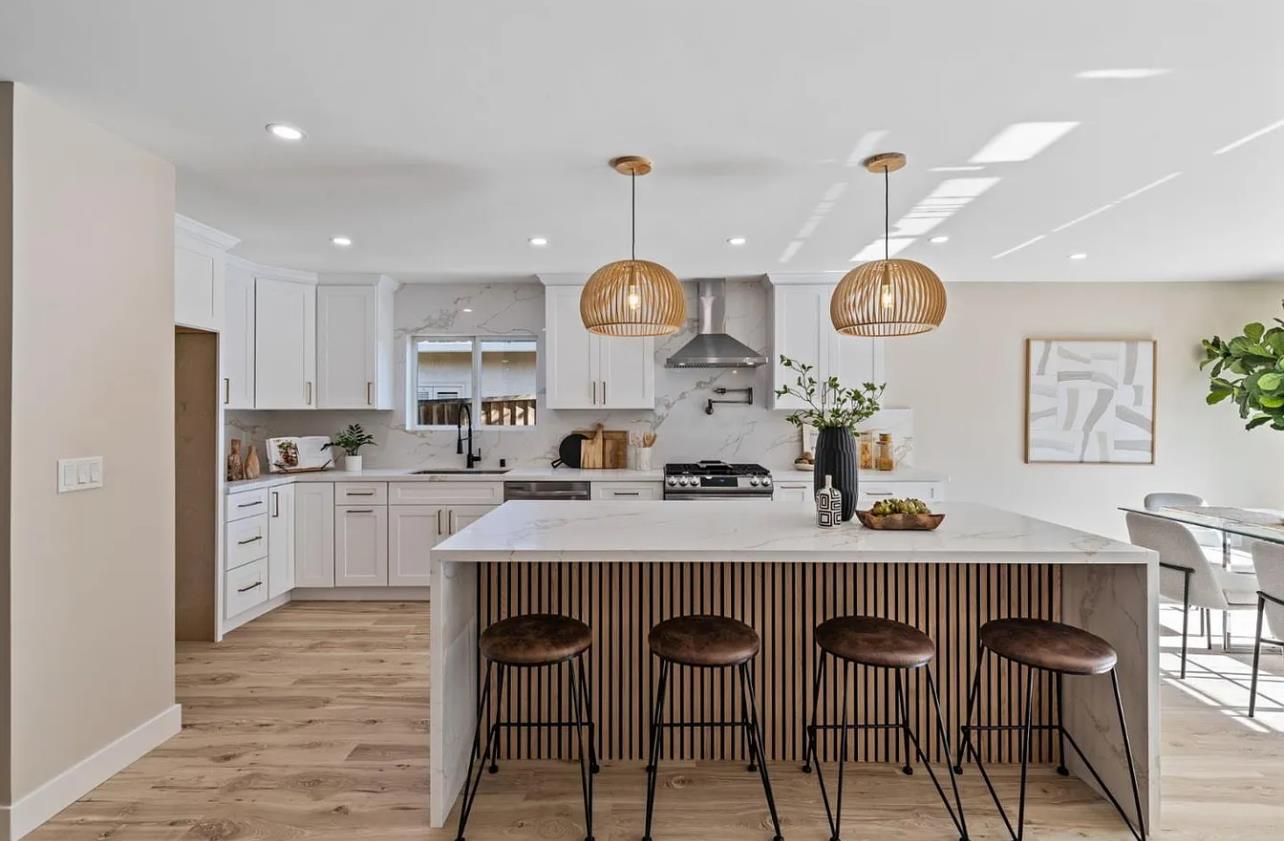 1439 Bittern Drive Sunnyvale, CA 94087 - Photo 3 of 28 a kitchen with a dining table chairs and cabinets