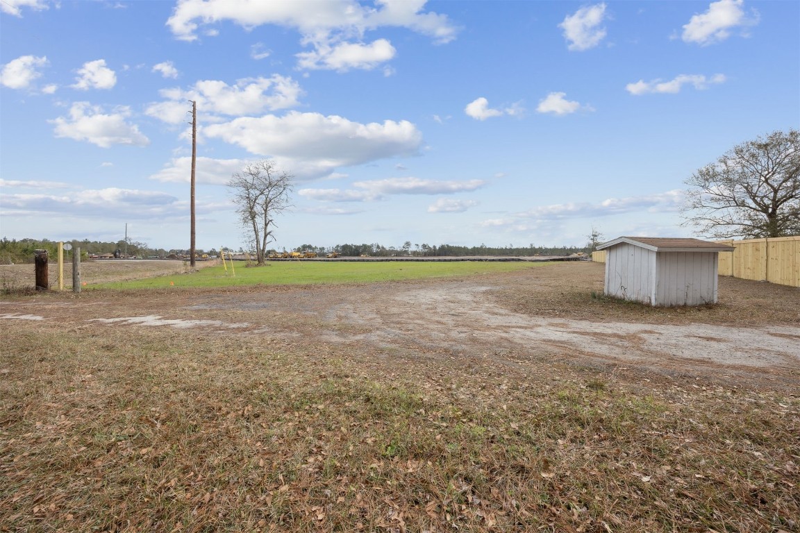 0 Henry Smith Road Hilliard, FL 32046 - Photo 9 of 9 a view of a lake with a big yard and a large tree