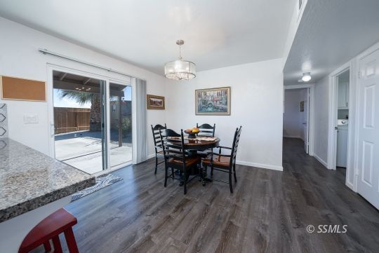 224 Richard Court Ridgecrest, CA 93555 - Photo 16 of 49 a view of a dining room with furniture and wooden floor