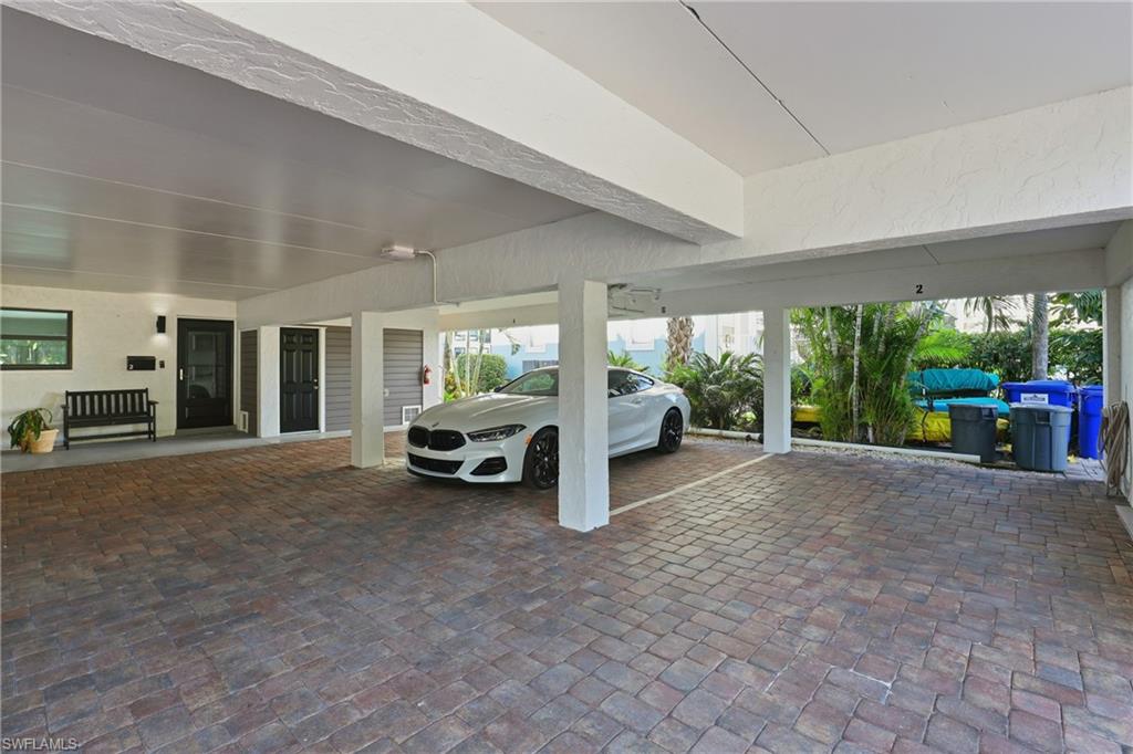 1320 Blue Point Avenue, Unit 2 Naples, FL 34102 - Photo 18 of 35 a view of a livingroom with furniture and a floor to ceiling window