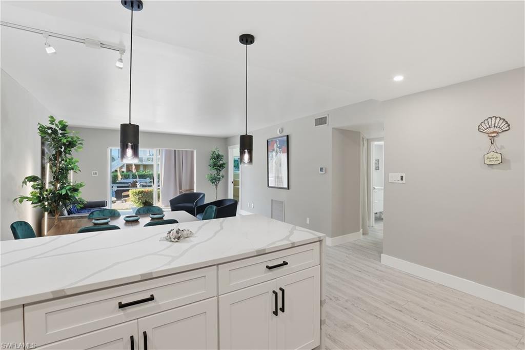 1320 Blue Point Avenue, Unit 2 Naples, FL 34102 - Photo 25 of 35 a bathroom with a sink and a mirror