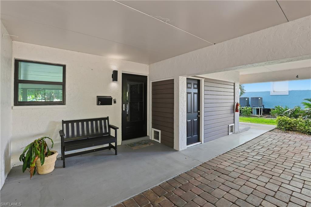 1320 Blue Point Avenue, Unit 2 Naples, FL 34102 - Photo 26 of 35 a view of a porch with furniture