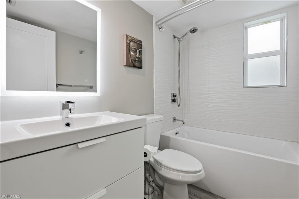 1320 Blue Point Avenue, Unit 2 Naples, FL 34102 - Photo 6 of 35 a bathroom with a sink toilet and shower