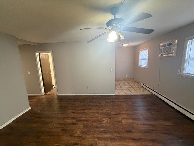 107 College Park Court, Unit 2 Normal, IL 61761 - Photo 1 of 8 an empty room with wooden floor and windows