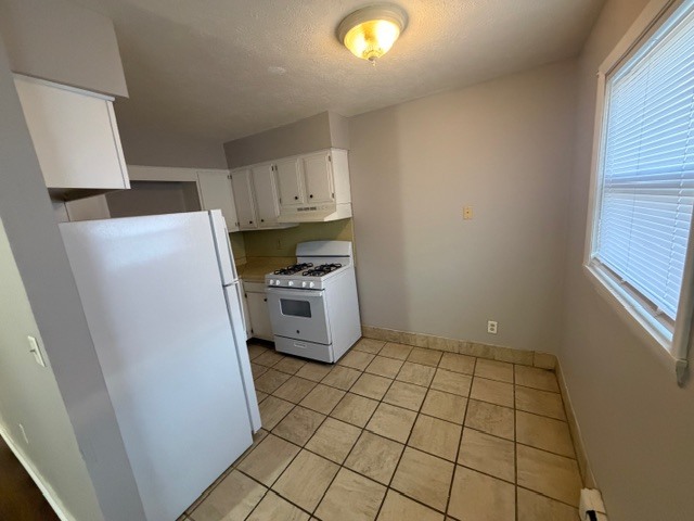 107 College Park Court, Unit 2 Normal, IL 61761 - Photo 3 of 8 a view of kitchen with a sink dishwasher and a refrigerator