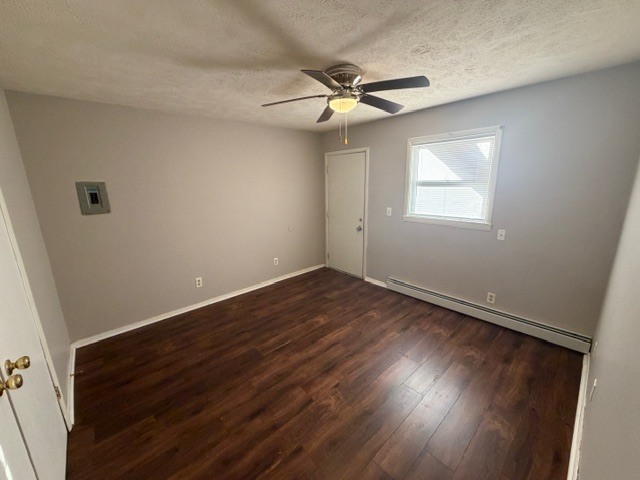 107 College Park Court, Unit 2 Normal, IL 61761 - Photo 8 of 8 an empty room with wooden floor fan and windows