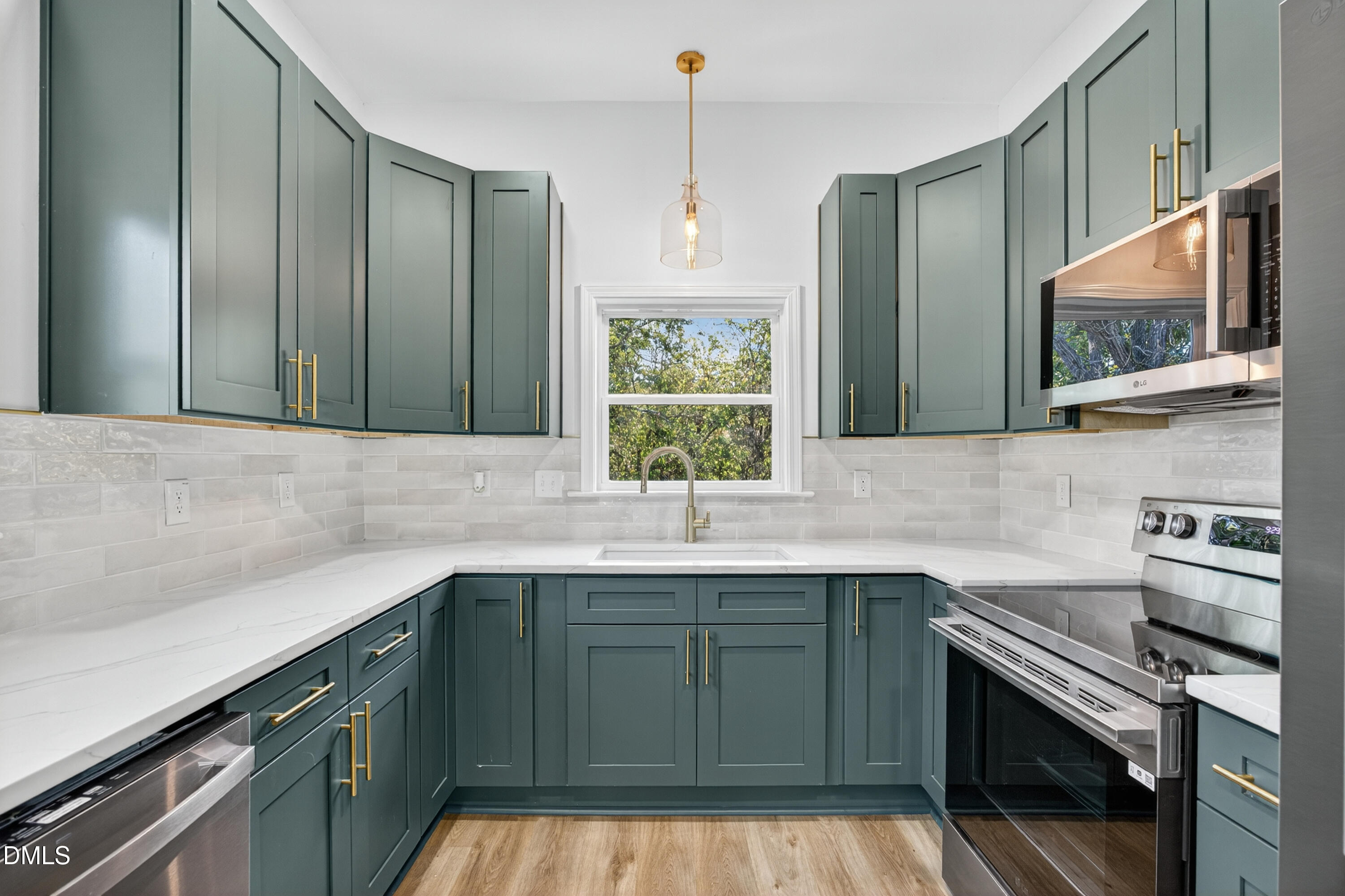 1043 George Bason Road Graham, NC 27253 - Photo 11 of 30 a kitchen with a sink stove and microwave