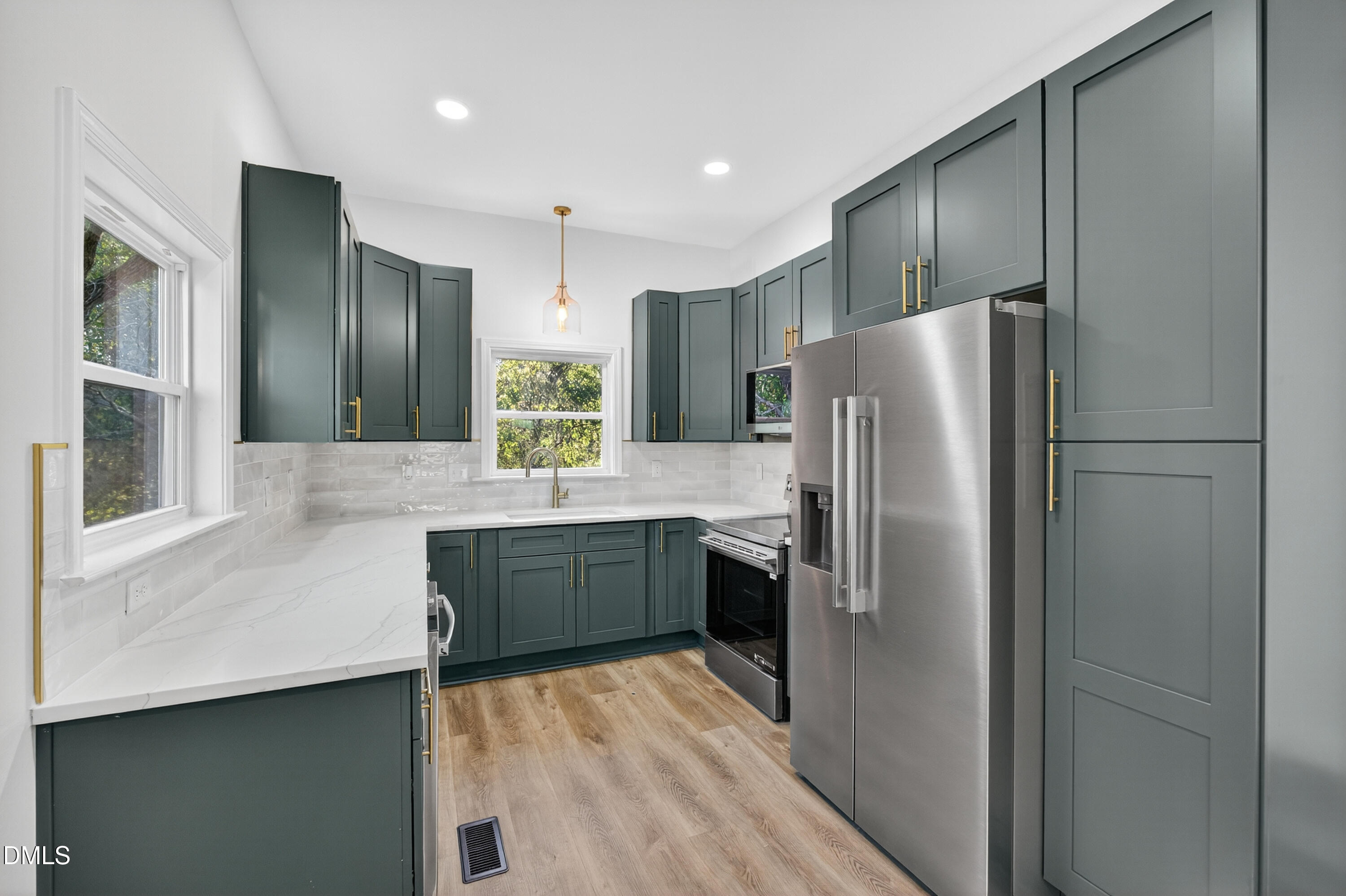 1043 George Bason Road Graham, NC 27253 - Photo 12 of 30 a kitchen with a refrigerator and a sink