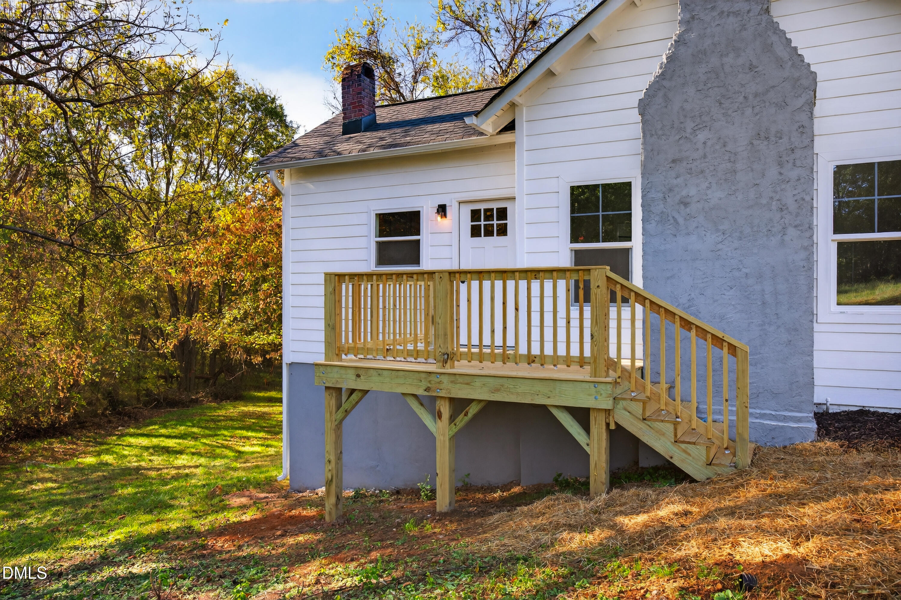 1043 George Bason Road Graham, NC 27253 - Photo 6 of 30 a view of a house with backyard and deck