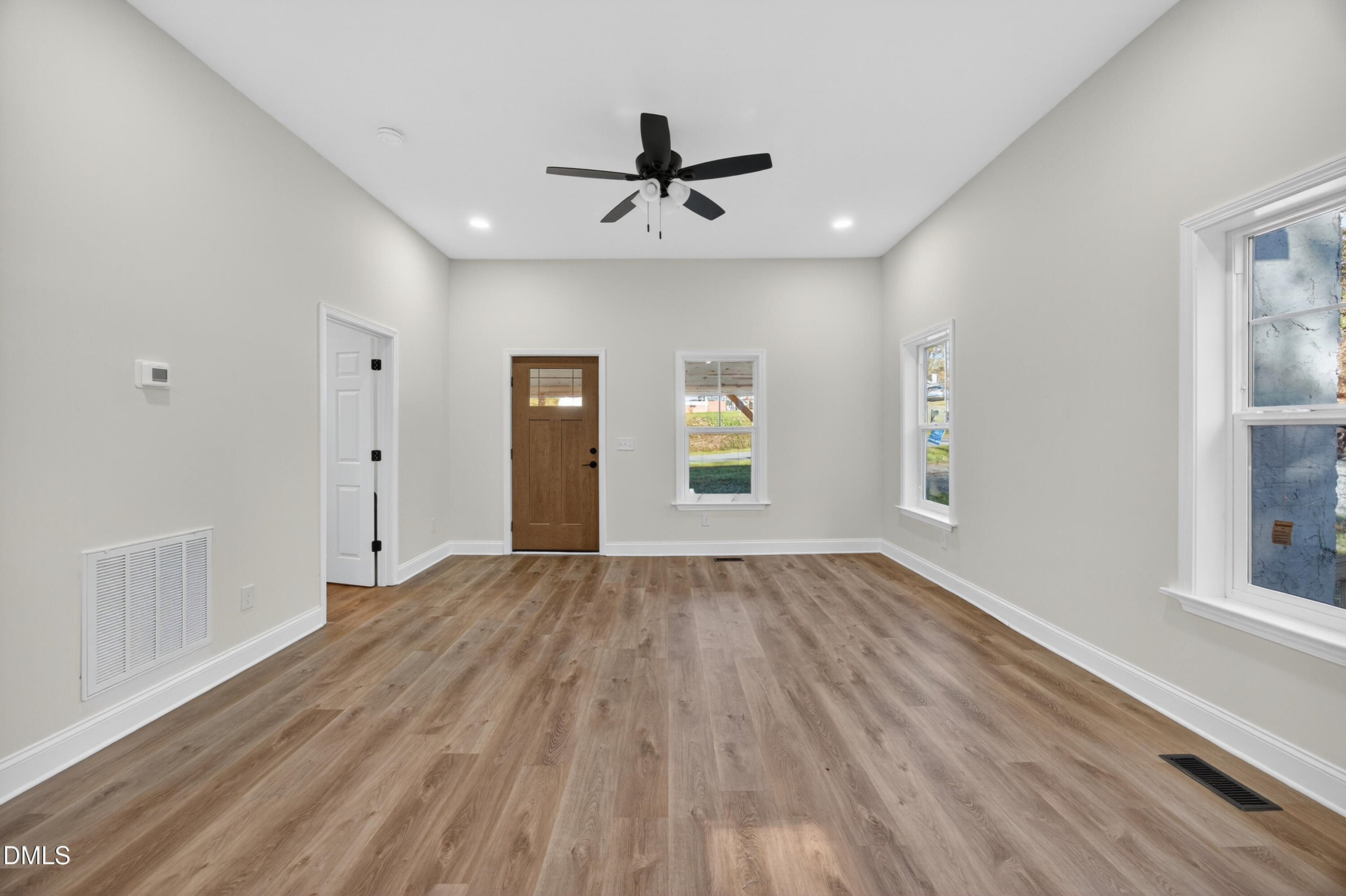 1043 George Bason Road Graham, NC 27253 - Photo 9 of 30 wooden floor in an empty room with a window