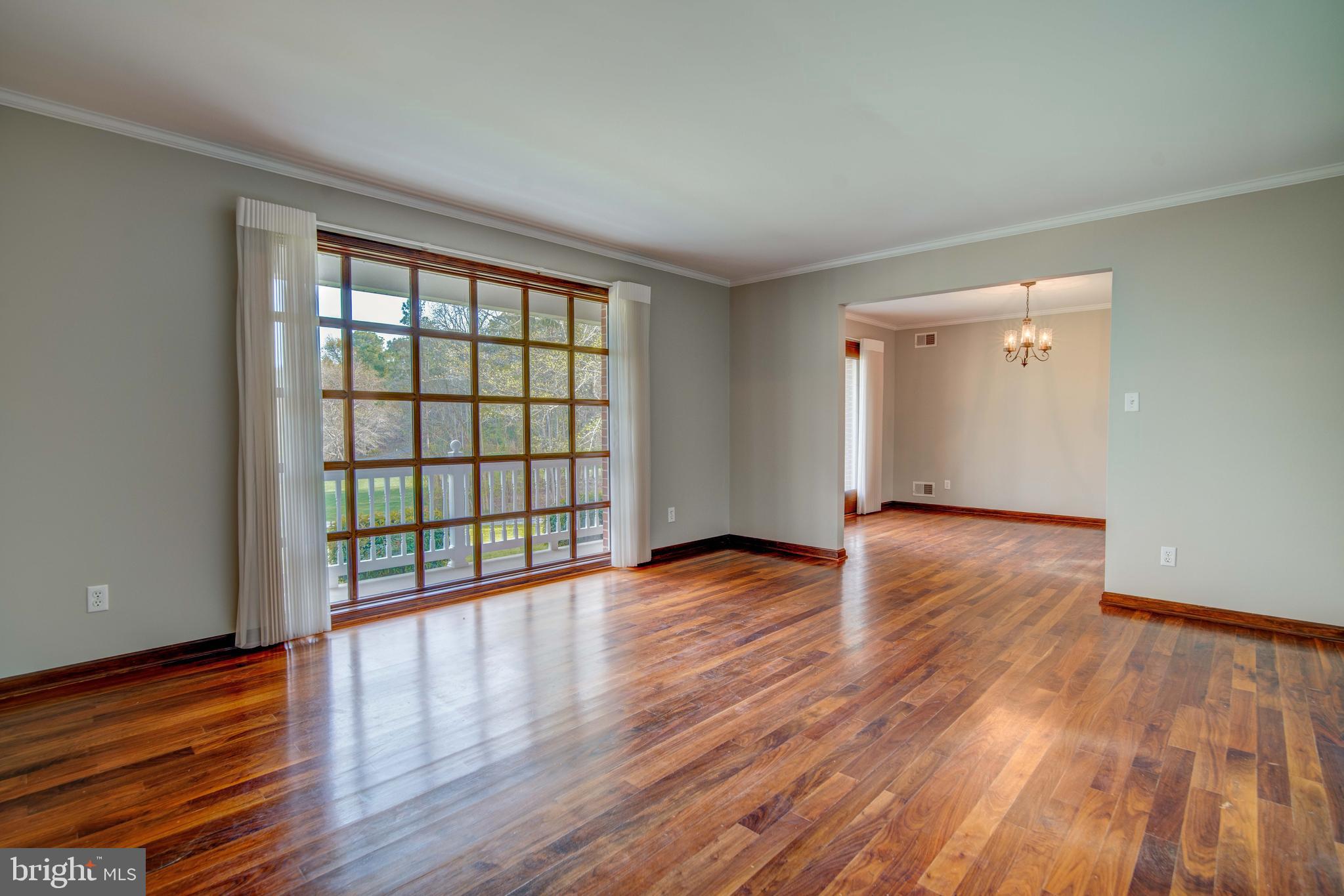 49530 Will's Road Dameron, MD 20628 - Photo 12 of 51 wooden floor in an empty room with a window