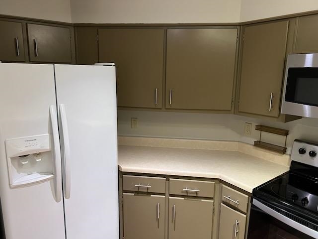 2277 Union Avenue, Unit 103 Memphis, TN 38104 - Photo 17 of 17 a kitchen with a refrigerator and a stove