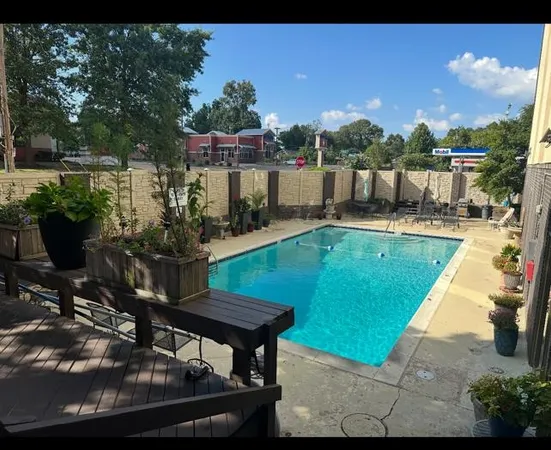 a view of a swimming pool with a patio