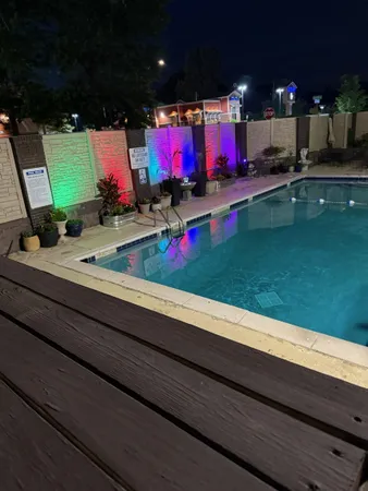 a view of swimming pool and outdoor seating