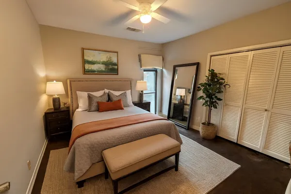 a bedroom with a bed and a walk in closet