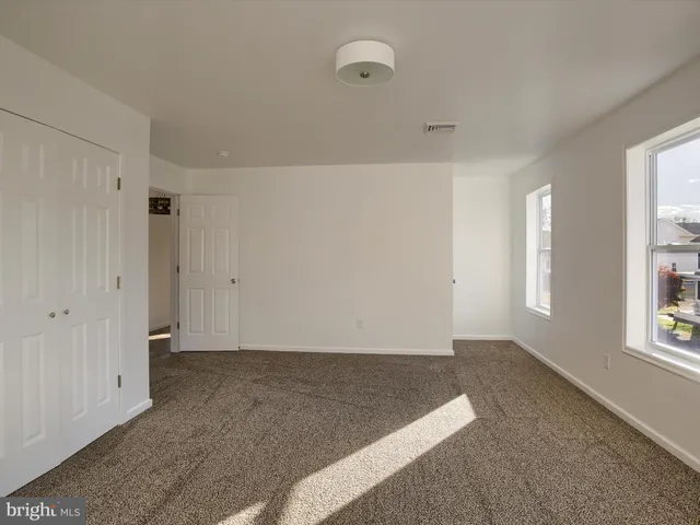 a view of a room with racks on the wall