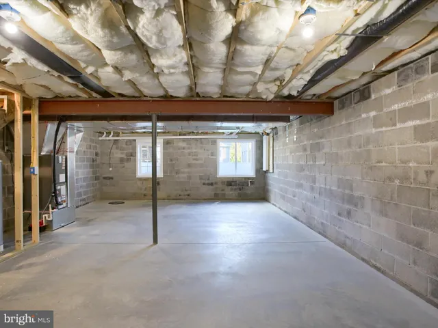 a view of a house with a big yard and large trees