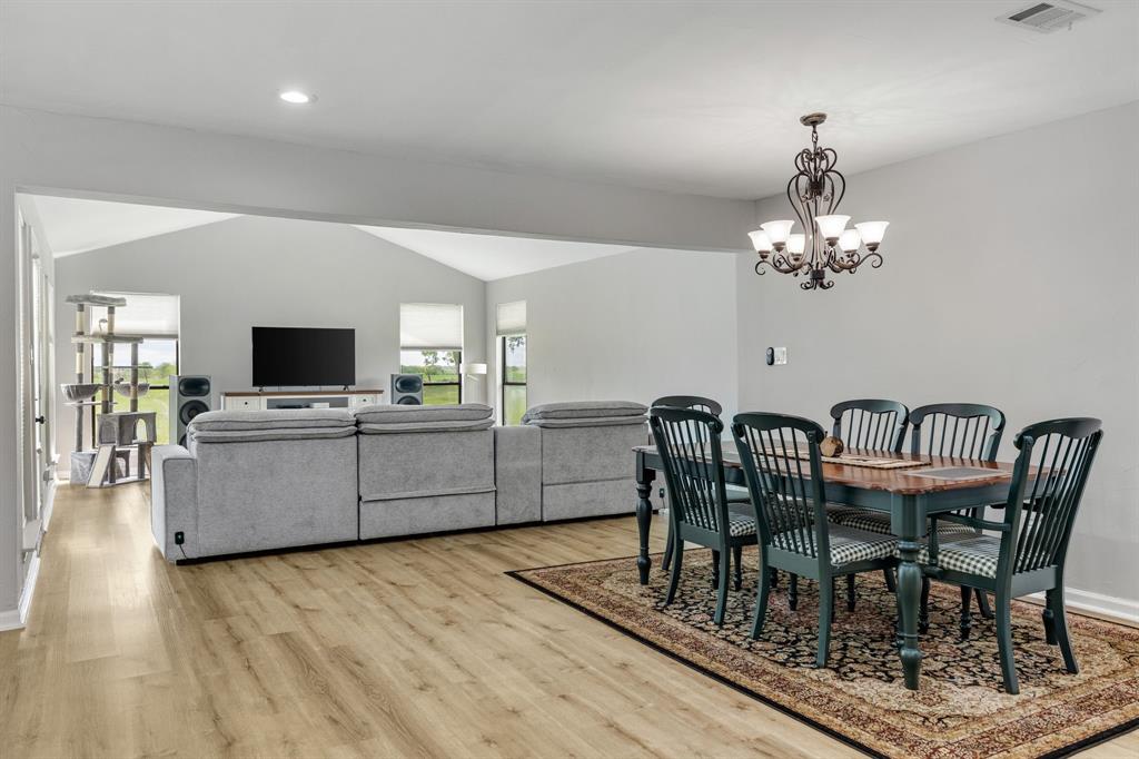 191 Klutts Road McLendon-Chisholm, TX 75032 - Photo 15 of 40 a view of a dining room with furniture and wooden floor