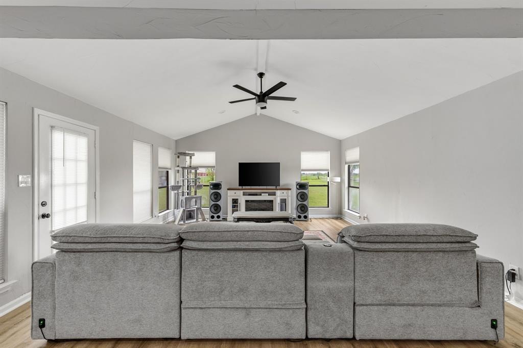 191 Klutts Road McLendon-Chisholm, TX 75032 - Photo 16 of 40 a living room with furniture and a fireplace