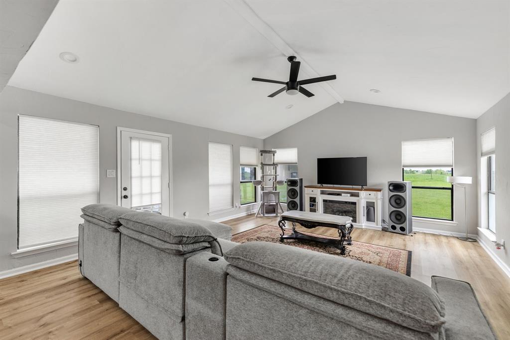 191 Klutts Road McLendon-Chisholm, TX 75032 - Photo 17 of 40 a living room with furniture and a flat screen tv