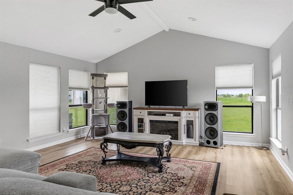 191 Klutts Road McLendon-Chisholm, TX 75032 - Photo 18 of 40 a living room with furniture and a flat screen tv