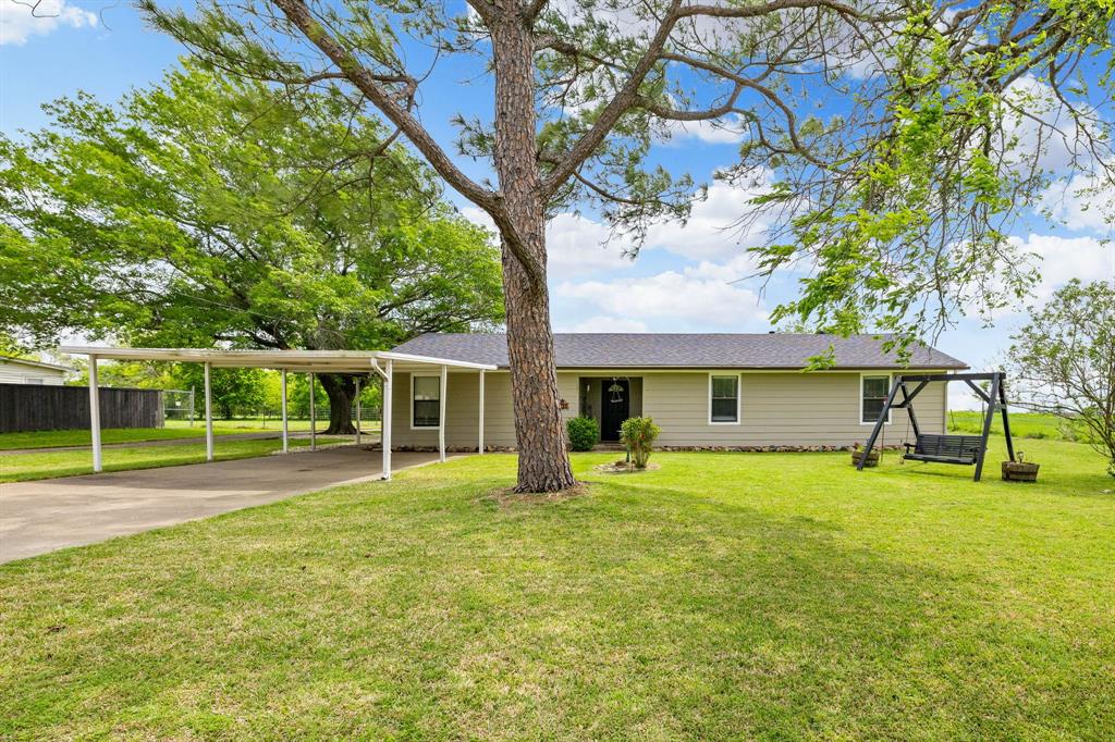 191 Klutts Road McLendon-Chisholm, TX 75032 - Photo 2 of 40 a view of a house with a yard and trees