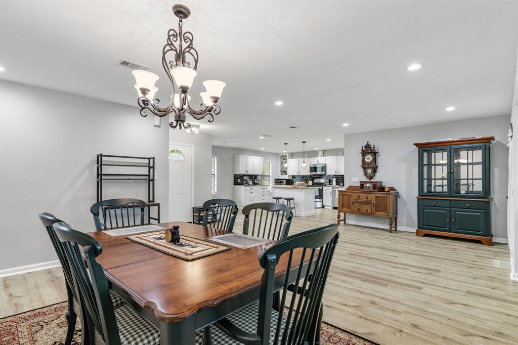 191 Klutts Road McLendon-Chisholm, TX 75032 - Photo 21 of 40 a view of a dining room with furniture window and wooden floor
