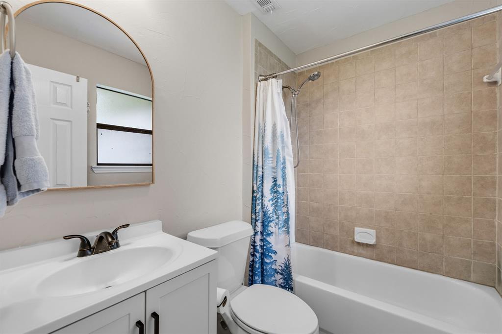 191 Klutts Road McLendon-Chisholm, TX 75032 - Photo 26 of 40 a bathroom with a sink toilet and shower
