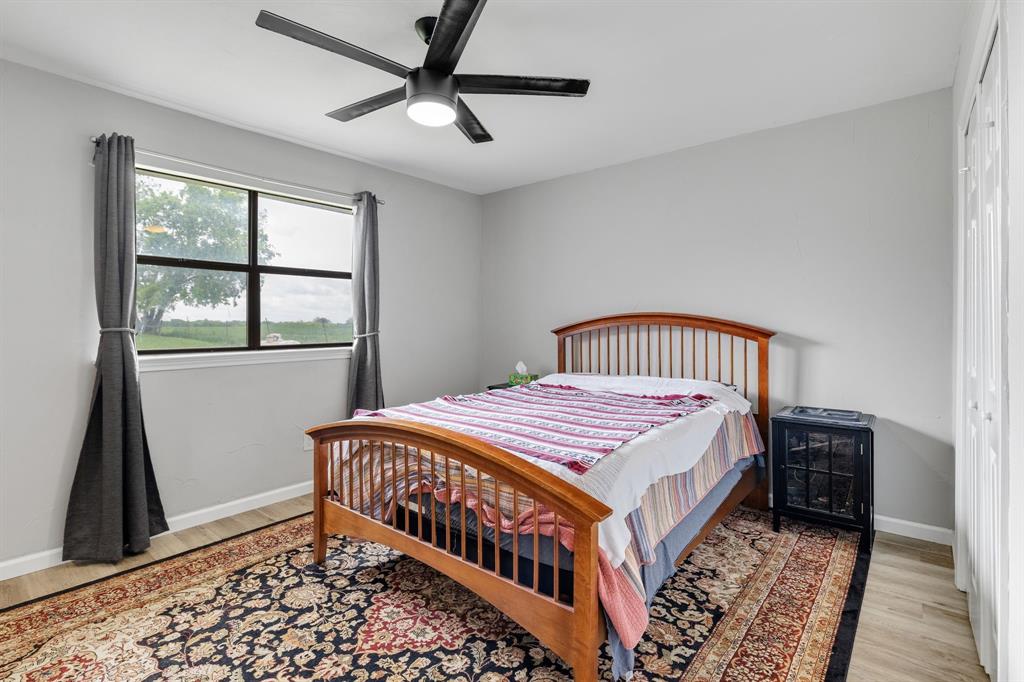 191 Klutts Road McLendon-Chisholm, TX 75032 - Photo 28 of 40 a bedroom with a bed next to a window