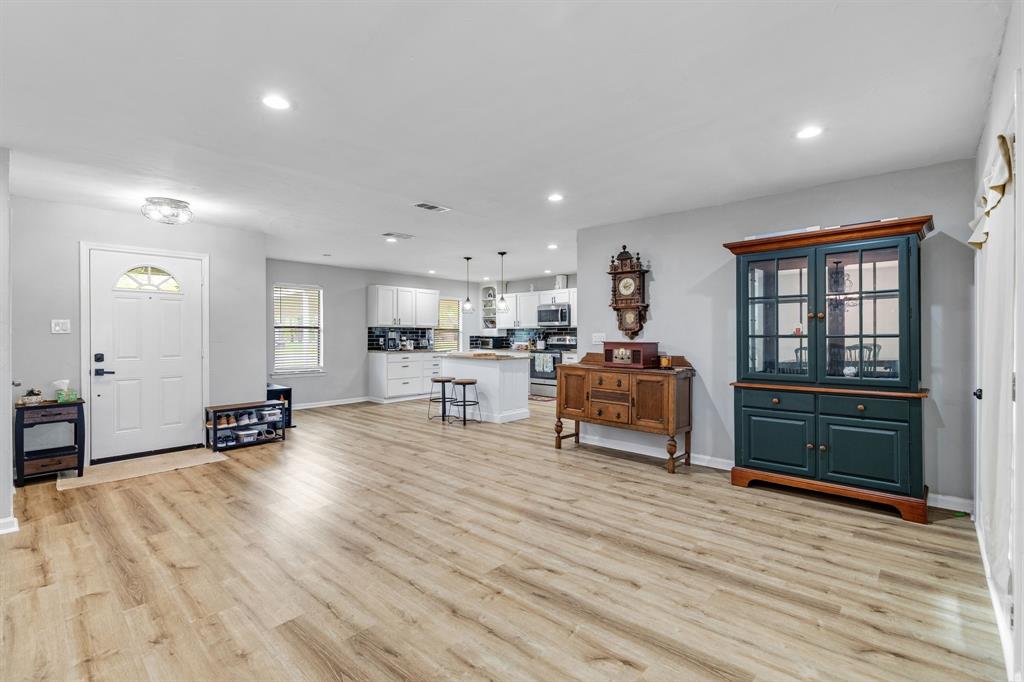 191 Klutts Road McLendon-Chisholm, TX 75032 - Photo 3 of 40 a living room with furniture and a wooden floor