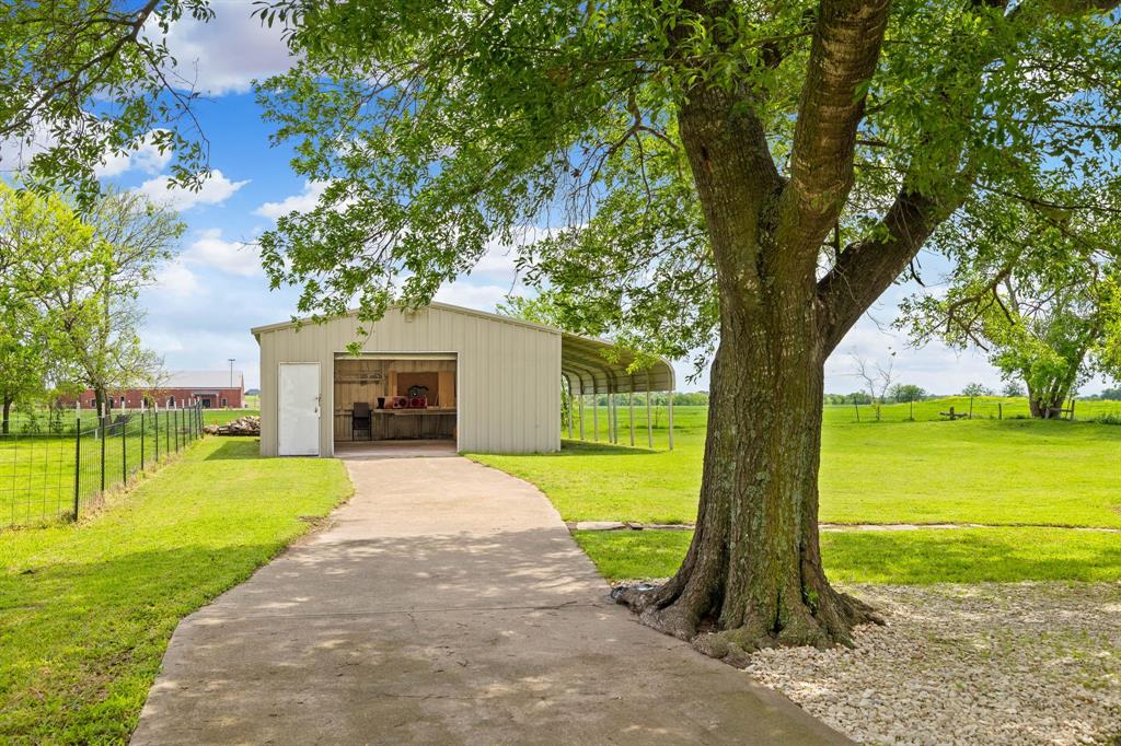 191 Klutts Road McLendon-Chisholm, TX 75032 - Photo 32 of 40 a front view of a house with garden