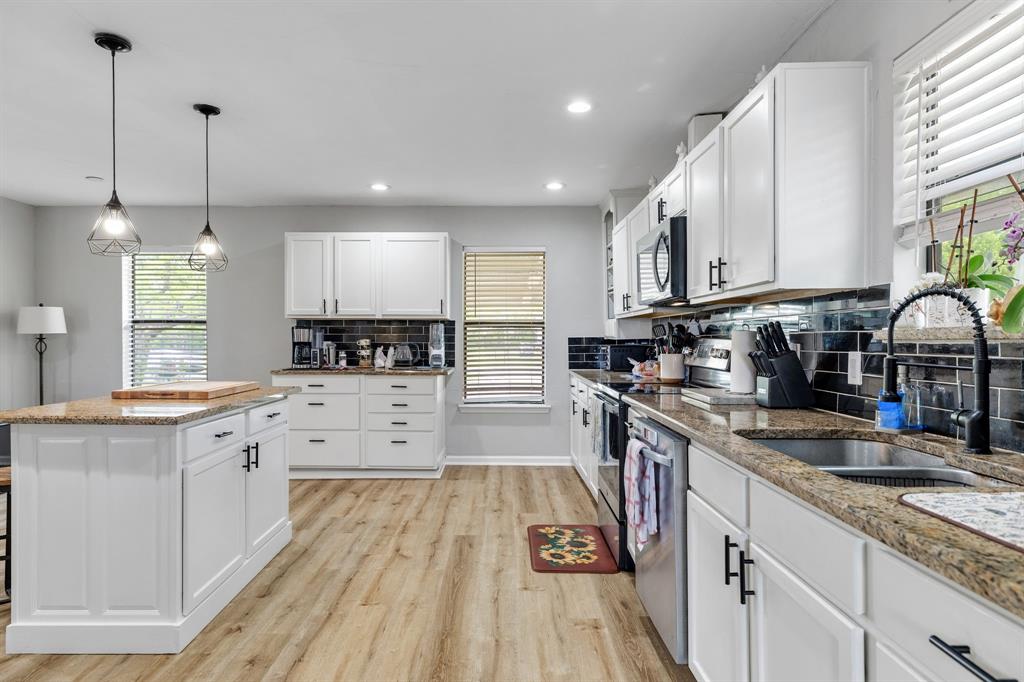 191 Klutts Road McLendon-Chisholm, TX 75032 - Photo 8 of 40 a large kitchen with stainless steel appliances granite countertop a stove sink and cabinets