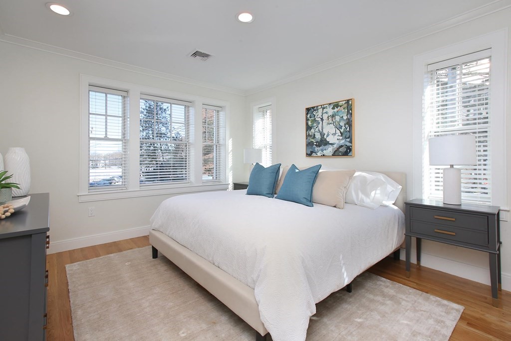 140 Sumner Road, Unit 2 Brookline, MA 02445 - Photo 9 of 20 a large bed sitting in a bedroom next to a window