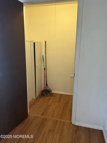 a view of a room with an empty space and a window