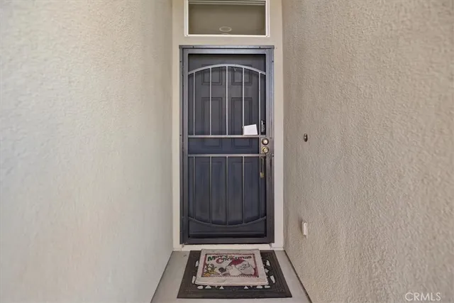 a view of a door and a window in the house