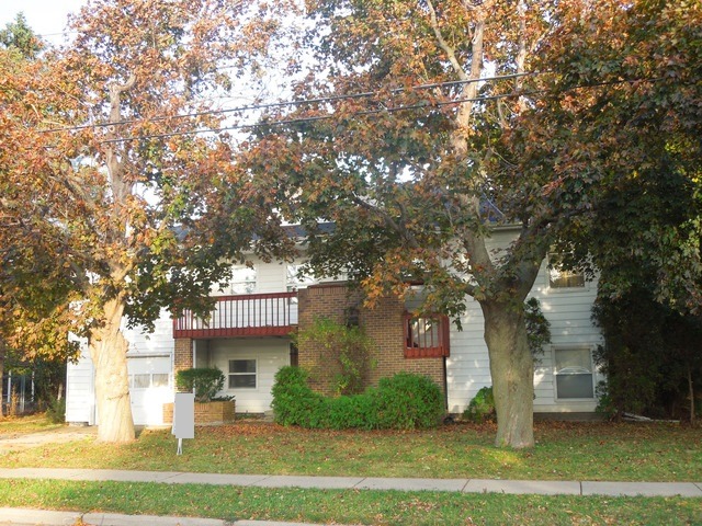 436 Russell Road DeKalb, IL 60115 - Photo 1 of 19 a front view of a house with a yard