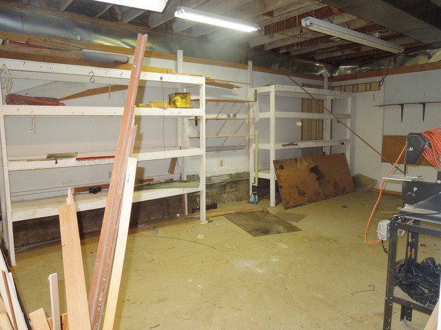 436 Russell Road DeKalb, IL 60115 - Photo 17 of 19 a view of a room with wooden shelves