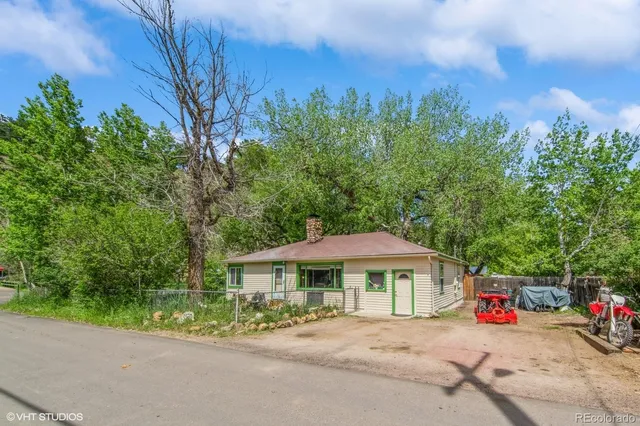 an outdoor view of a house with a yard
