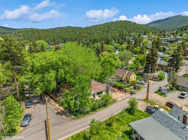 a view of a city with green space