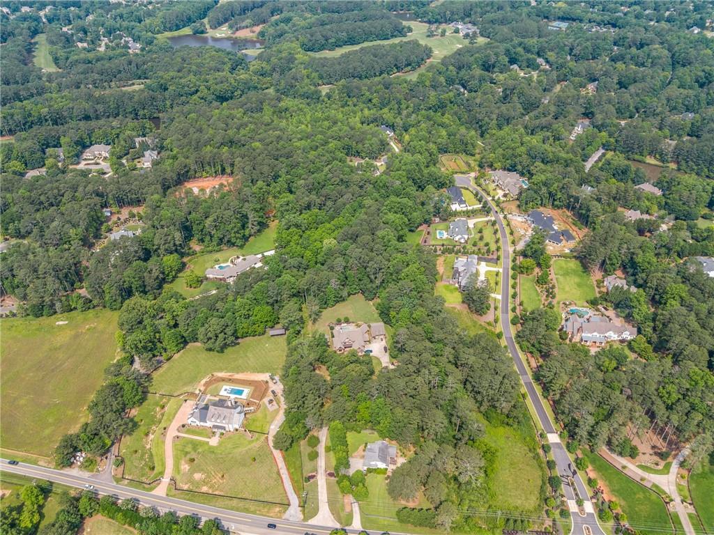 240 Brock Trail Milton, GA 30004 - Photo 30 of 31 an aerial view of residential houses with outdoor space and trees
