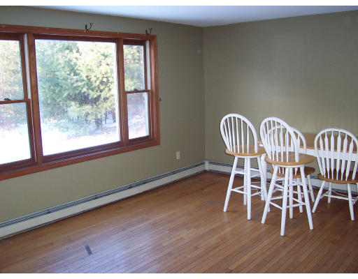 100 Eagleville Road Orange, MA 01364 - Photo 5 of 7 a view of a room with wooden floor and windows