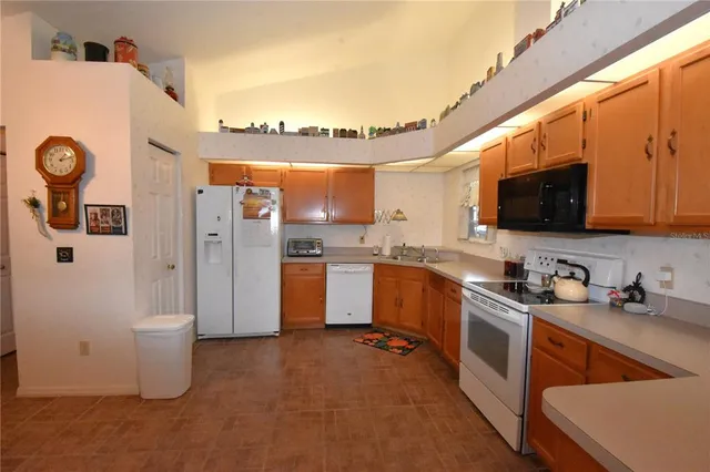 a view of a livingroom with furniture and chandelier