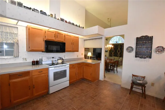 a view of a livingroom with furniture and a window