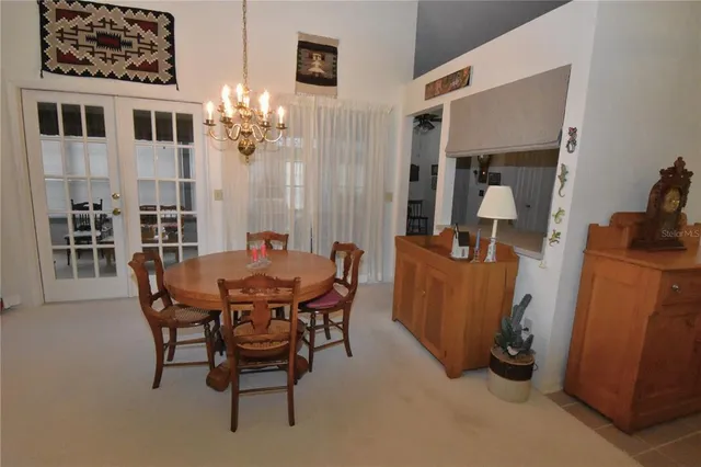 a living room with furniture a piano and a flat screen tv