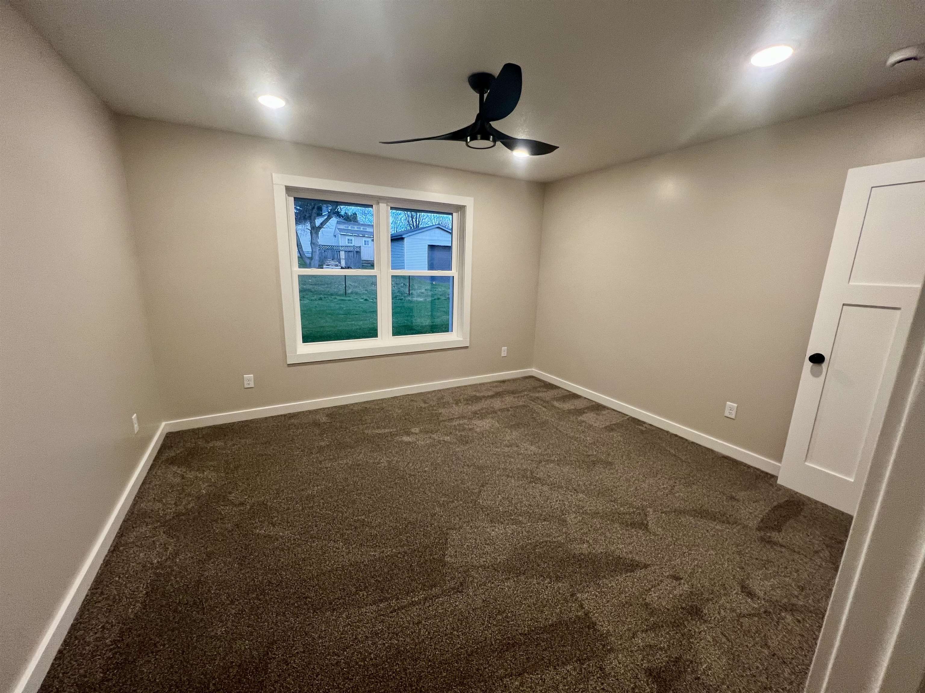 1006 26th Street, Unit B Cloquet, MN 55720 - Photo 20 of 27 Spare room featuring dark colored carpet, a ceiling fan, recessed lighting, and a smoke detector
